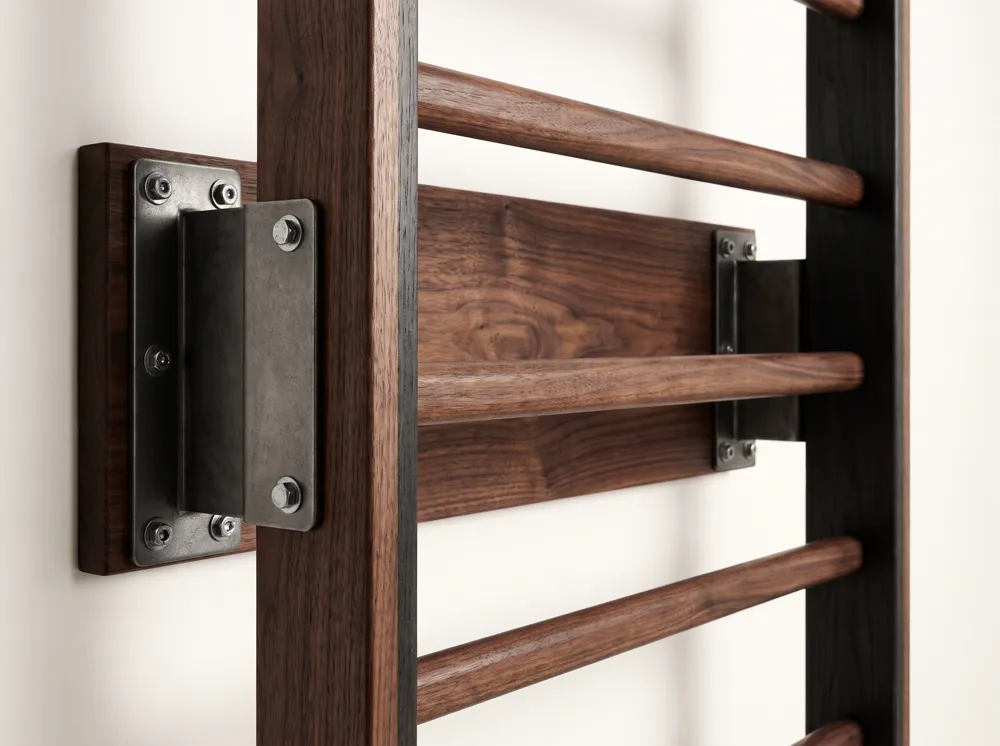 Blackened steel wall bracket bolted through a walnut backboard